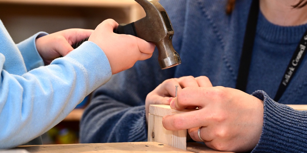 Adult helping a child