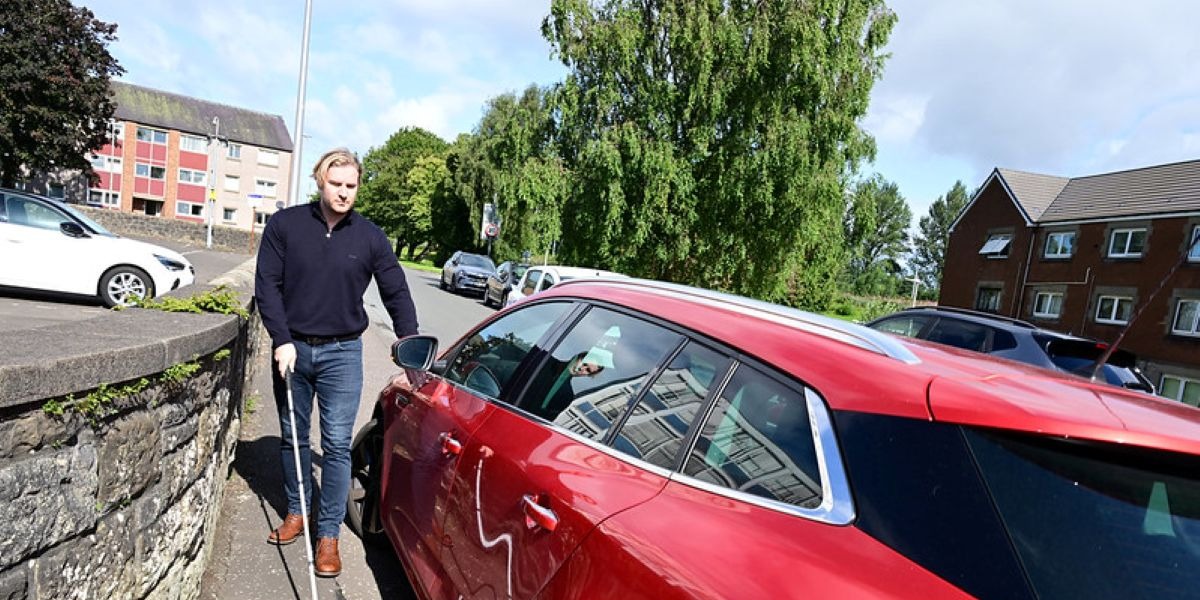 📷 Allan McBride is severely sight impaired and finds it difficult to navigate safely past parked cars on pavements.