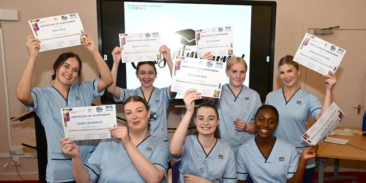 📷  Healthcare Academy graduates celebrate with their certificates at Grangemouth Municipal Chambers. 