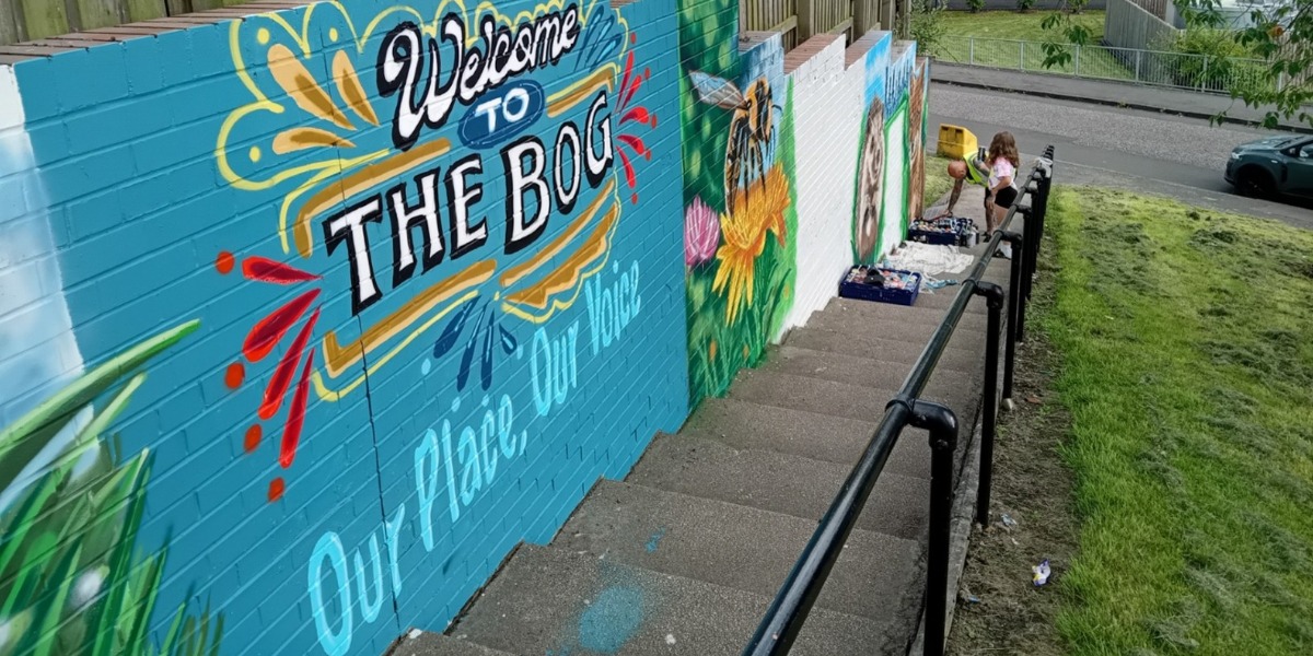 A vibrant mural created by a local artist in collaboration with volunteers