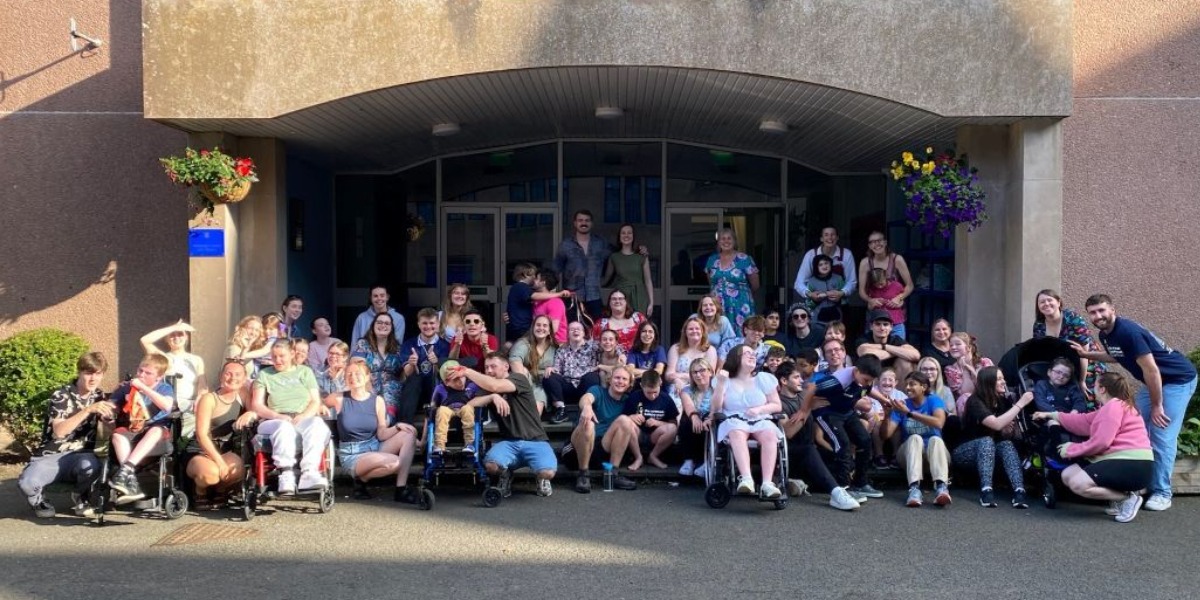 📷 Lauren (back, centre) with other volunteers and young people enjoying the Scottish sunshine. 