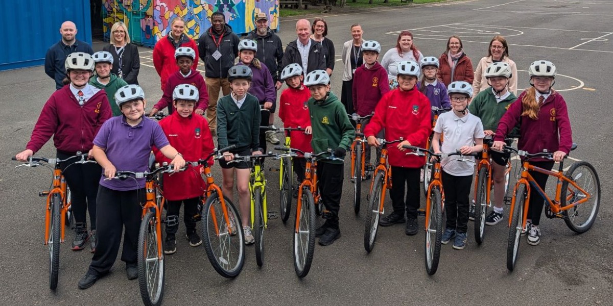 📷 Councillor Paul Garner with pupils and representatives from Falkirk Council and SEStrans with some of the bikes and helmets bought with the funding.